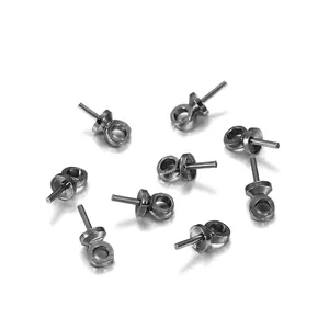 Ten pieces of gunmetal grey pearl peg bails for DIY jewelry making on white background