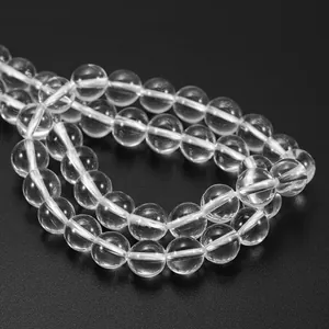 Macro detail of polished clear quartz beads with high transparency for DIY jewelry making