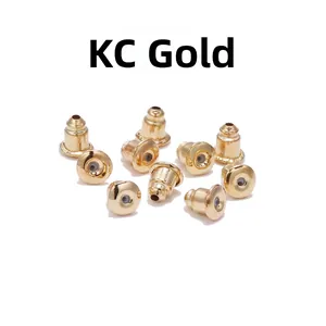 Detail view of KC Gold earring backs with metal shell and transparent inner stopper