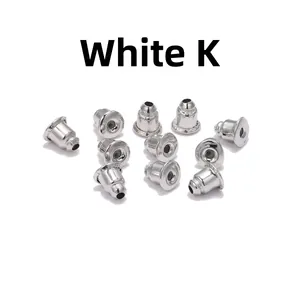 Macro detail of bulk white gold color metal bullet earring backs for DIY jewelry making