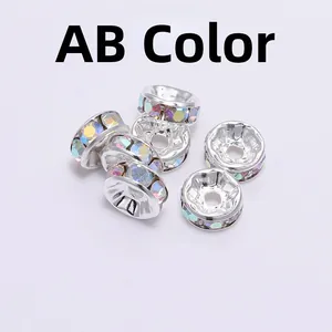 Macro detail of silver spacer beads with iridescent AB color rhinestones for DIY jewelry