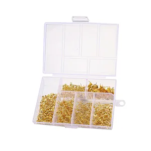 Macro view of gold plated DIY earring findings set in a clear plastic storage box