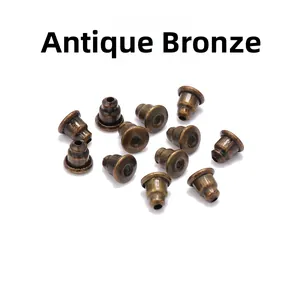 Macro view of antique bronze bullet clutch earring backs for DIY jewelry making