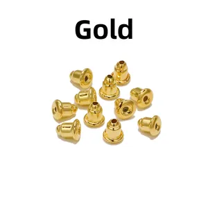 Macro view of gold-plated metal bullet earring backs for DIY jewelry findings