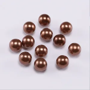 Macro shot of smooth dark brown pearlescent ABS beads for DIY jewelry making