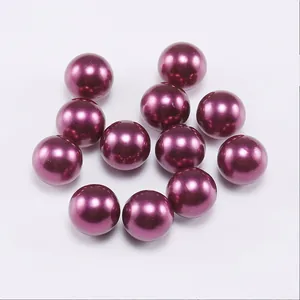 Detailed view of glossy dark purple round ABS faux pearls for DIY jewelry making crafts