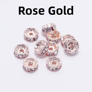 Macro shot of rose gold rondelle spacer beads with crystals for DIY jewelry making