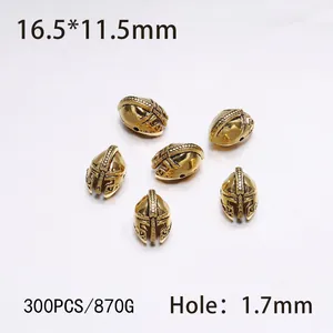 Macro view of gold Spartan helmet metal beads with 16.5x11.5mm size for jewelry DIY