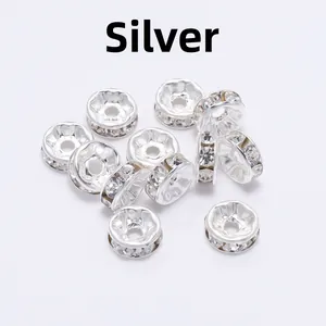 Detailed macro view of silver rhinestone spacer beads for DIY jewelry making