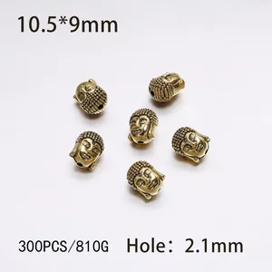 Detail view of antique gold Buddha head beads for jewelry making with 10.5x9mm dimensions