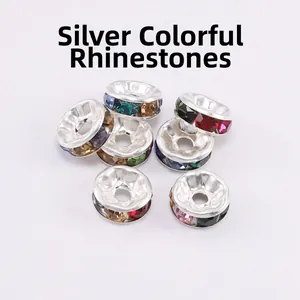 Macro shot of silver alloy spacers with multicolored rhinestones for DIY jewelry making
