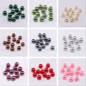 Macro view of multi-colored ABS faux pearls in a grid showing glossy spherical beads