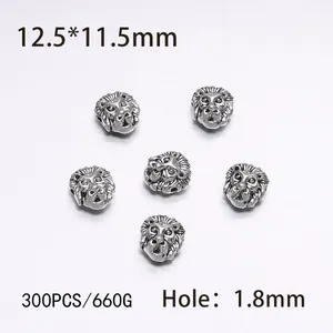 Macro detail of antique silver lion head alloy beads showing size 12.5x11.5mm and 1.8mm hole