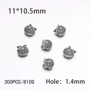 Detailed view of antique silver owl beads with 11x10.5mm size and 1.4mm hole for DIY jewelry