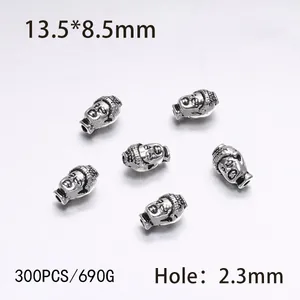 Macro detail of alloy Buddha head beads with dimensions and hole size for DIY jewelry
