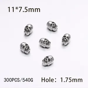 Close-up of 11x7.5mm silver skull beads for DIY jewelry with 1.75mm hole size