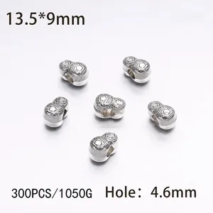 Detailed view of silver matryoshka beads with 13.5x9mm dimensions for DIY jewelry