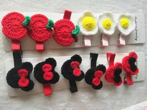 Handmade crochet hair clips with apple and mouse designs on ribbon duckbill clips