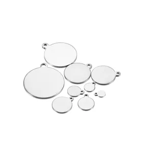 Macro view of various sized round stainless steel pendant tags with hanging holes