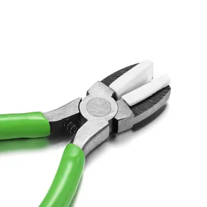 Detail of jewelry pliers with white nylon jaws and green non-slip rubber handles