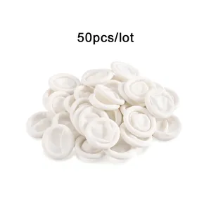 Detailed view of 50pcs thick white rubber finger cots for DIY and protective hand use