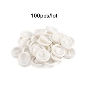 Macro shot of 100 white latex finger cots with rolled edges for industrial protection