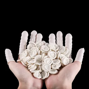 Close-up of white latex finger cots with anti-slip texture and rolled rim for protection