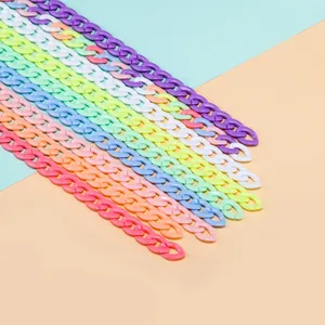 Macro shot of colorful acrylic chain links in macaron shades for DIY jewelry making