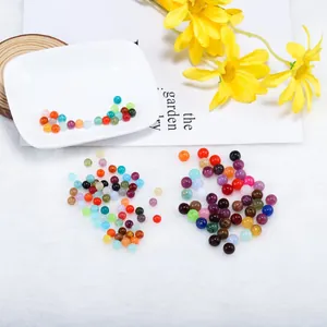 Colorful round glass beads in various vibrant colors for DIY jewelry and bracelet making