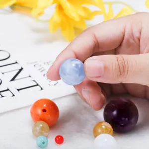 Close-up of colorful mixed DIY beads with polished finish and pre-drilled holes