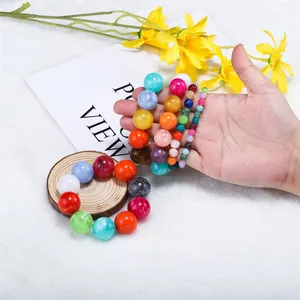 Detailed macro shot of colorful synthetic agate round beads for DIY jewelry making sets