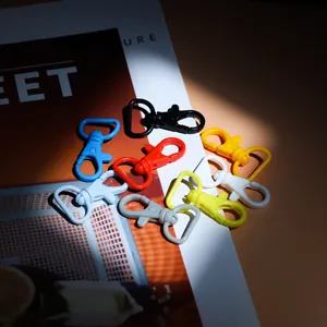 Detail showing various candy-colored 40mm lobster clasps with 360-degree rotating D-rings