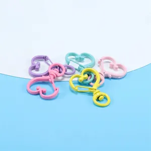 Detailed view of colorful macaque heart-shaped lobster clasps with swivel rings