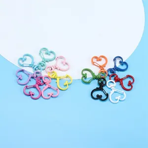 Colorful heart-shaped swivel lobster clasps in various painted alloy finishes for DIY jewelry