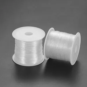 Détails de deux bobines de fil de nylon transparent pour la création de bijoux DIY
