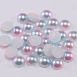 Macro view of gradient flatback resin pearls for DIY nail art and phone case decoration