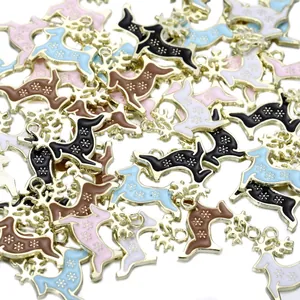 Macro shot of colorful enamel reindeer alloy pendants with gold plating for DIY jewelry making