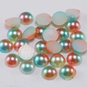 Macro detail of gradient iridescent flatback half pearls for DIY crafts and nail art