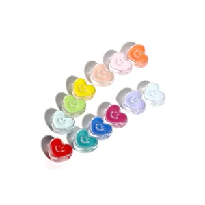 Detailed view of colorful heart-shaped acrylic smile beads for DIY jewelry making