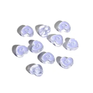 Detailed view of heart-shaped acrylic beads with purple core and white smiley face charm
