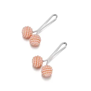 Set of 2 pink pearl bead scarf clips with silver steel pins on a clean white background
