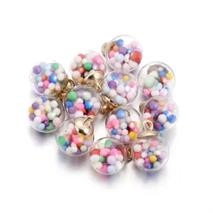 Macro shot of clear star glass globes with colorful beads and gold metal loops