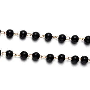 DIY black bead necklace chain with gold metal links for jewelry making projects