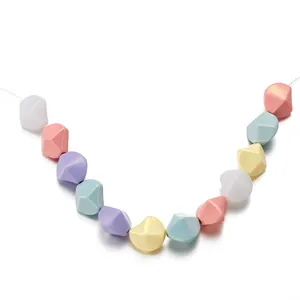 Brin de perles acryliques facettées en forme de U en rose pastel jaune et bleu