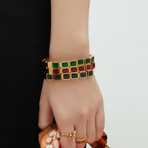 18k gold plated stainless steel bangle with three rows of colorful rectangular gemstones