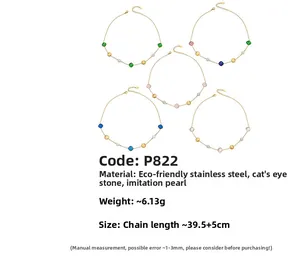 Detailed view of 18k gold plated stainless steel necklaces with cat eye stones and pearls