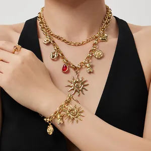 Gold chunky chain jewelry set featuring sun, bear, and gemstone charms for women