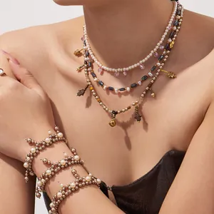 Boho-Set aus grauen Perlen und Edelstahlketten mit Hamsa-Anhängern im Lagenlook für Damen