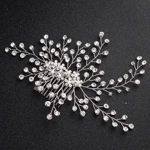 Elegant bridal hair comb with silver rhinestones and pearls on a sleek black background