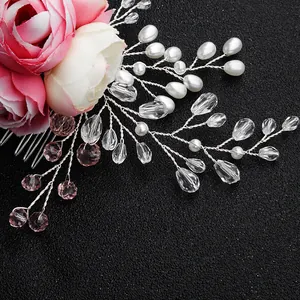 Detailed view of handmade pink silk roses with crystal beads and pearl hair comb